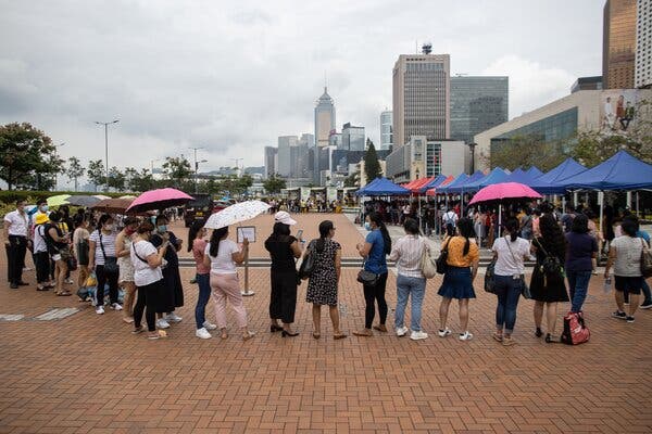 Foreign domestic workers waited to be tested for the coronavirus in Hong Kong on Sunday.