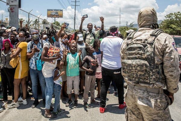 Haitians asking for asylum in front of the U.S. Embassy on Saturday.