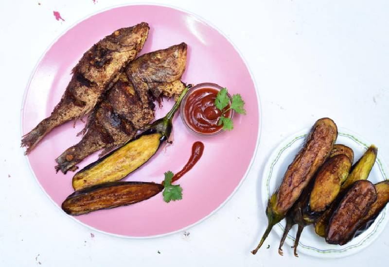 Swahili fried fish and eggplant Eve woman