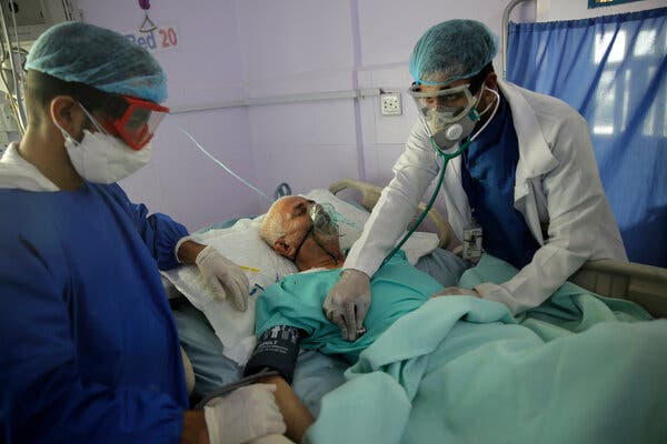 Medical workers attend to a Covid-19 patient last year in an intensive care unit at a hospital in Sana, Yemen.