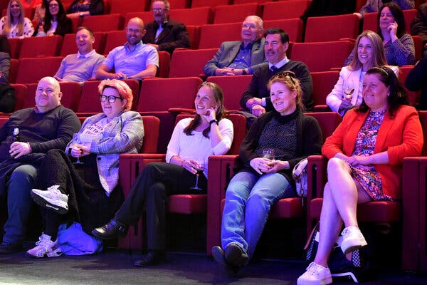 An audience watching a comedian in Liverpool, England, this week.