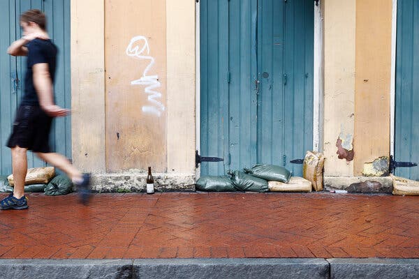 Sand bags block the entrance to a doorway on Bourbon Street in New Orleans on Sunday.