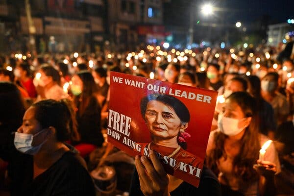 A protester holding a poster with an image of the detained civilian leader Daw Aung San Suu Kyi in Yangon, Myanmar, in March.