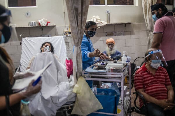 Patients with Covid-19 in the emergency ward at the Holy Family hospital in New Delhi on Thursday.