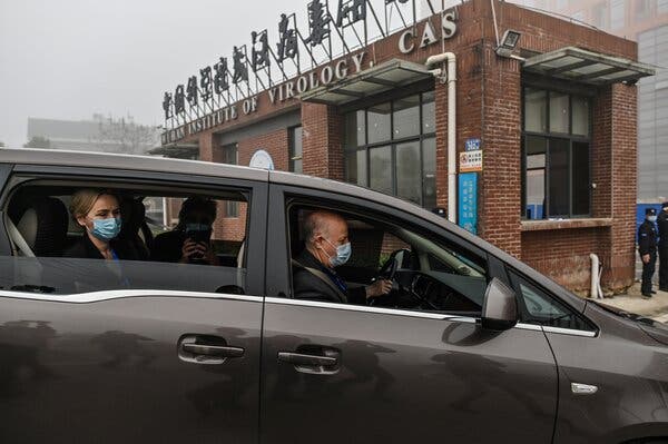 Experts from a World Health Organization team arriving earlier this year at the Wuhan Institute of Virology, in the Chinese city where Covid-19 emerged.