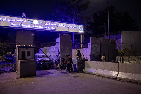 Taliban fighters at Kabul’s international airport on Saturday.