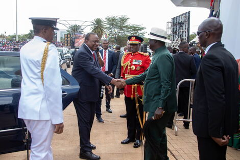 Former Prime Minister Raila Odinga receiving President Uhuru Kenyatta at Uhuru Gardens for the Madaraka Day celebrations on June 1, 2022.