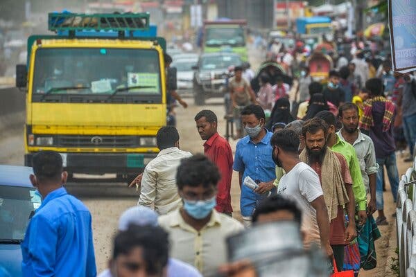 On the move in Dhaka, Bangladesh, on Monday as the government began to implement new lockdown measures.