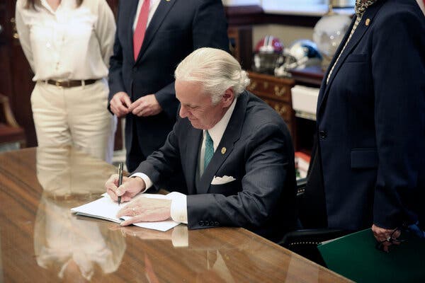 Governor Henry McMaster of South Carolina  signing a bill on April 22 requiring schools to provide in-person classes five days a week starting on April 26, in Columbia, S.C. 
