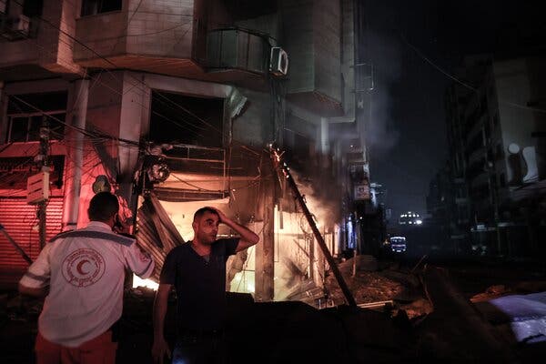 At a scene after Israeli airstrikes struck early Sunday in Gaza City.