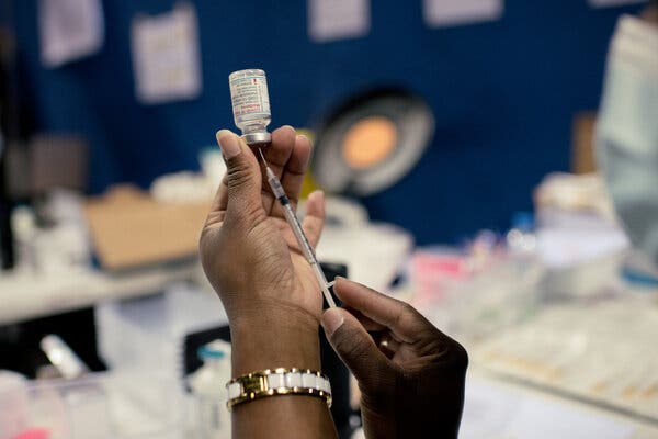 A health worker preparing a dose of Moderna’s Covid vaccine at a medical center near Paris in March.