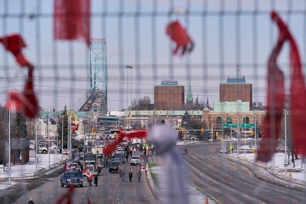 Protestors opposing vaccine mandates blocking the roadway at the Ambassador Bridge border crossing, in Windsor, Ontario, on Wednesday.