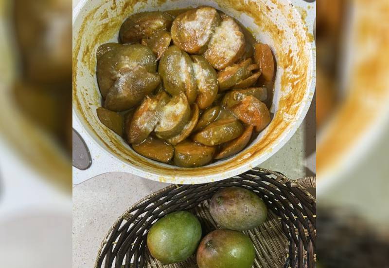 Cooked Swahili mangoes Eve woman