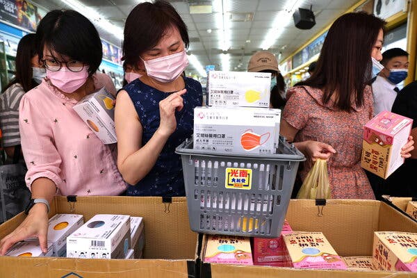 Buying protective face masks following a small outbreak of coronavirus disease in Taipei, Taiwan, on Wednesday.