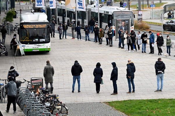 People waiting to get a Covid vaccination in Salzburg, Austria, on Monday, as a nationwide lockdown began for unvaccinated people.