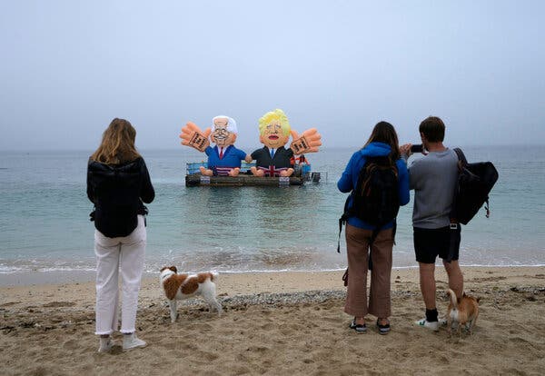 Floating balloons caricaturing President Biden and Prime Minister Boris Johnson of Britain in the harbor of Falmouth, England, on Friday.
