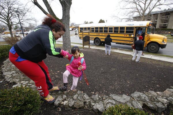 Harka Gurung and her 8-year-old daughter, Eden, are part of a family from Bhutan who moved to Columbus, Ohio, from a refugee camp in Nepal.