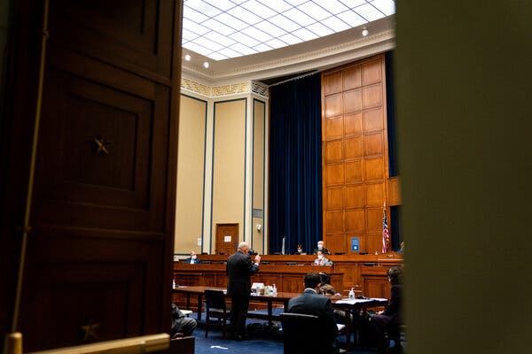 Louis DeJoy, the postmaster general, was sworn in for a hearing before the House Oversight and Reform Committee on Monday.