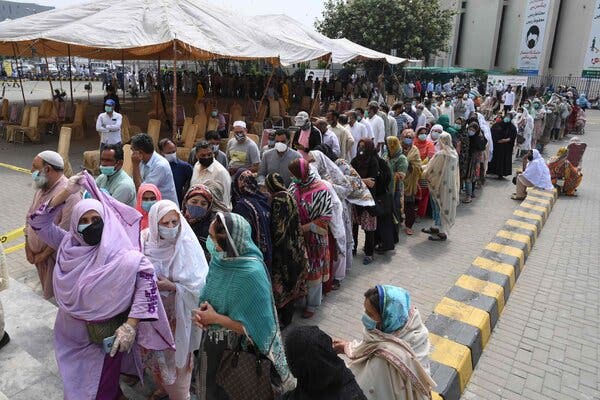 Lining up to receive the Sinopharm vaccine in Lahore, Pakistan, on Wednesday.