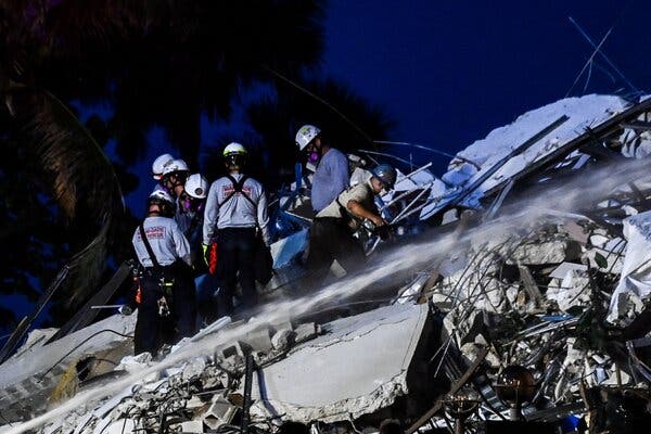 Search-and-rescue personnel worked at the collapse site on Thursday evening.