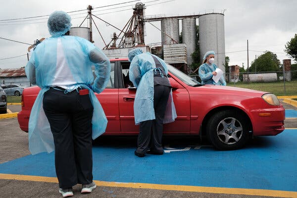Medical workers dispensed vaccines at a pop-up clinic in rural Leland, Miss., in April. Only 33 percent of residents in the state are immunized.