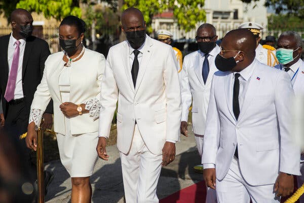President Jovenel Moïse, center,  with his wife, Martine, and the interim prime minister, Claude Joseph, at a ceremony in the Haitian capital,Port-au-Prince, in May.