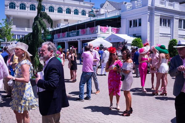 Horse racing fans in the paddock area at Churchill Downs on Friday.