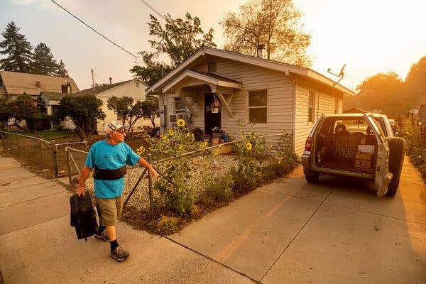 Gary Mooney prepared to evacuate his home on Monday as the Dixie fire burned toward Susanville, Calif.