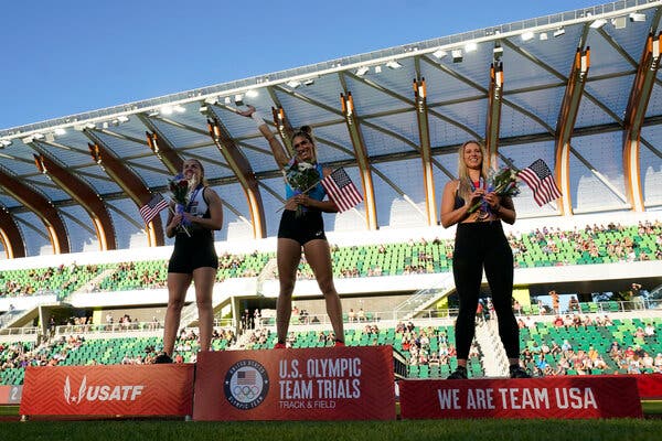 Valarie Allman, first, center, Micaela Hazlewood, second and Rachel Dincoff, third, left, stand on the podium after the women's discus throw at the U.S. Olympic Track and Field Trials.