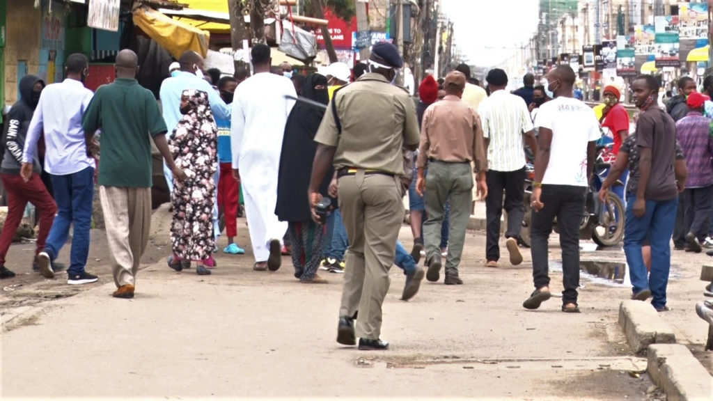 A police officer enforcing the cessation of movement in Eastleigh, Nairobi. /MOSES MUOKI.