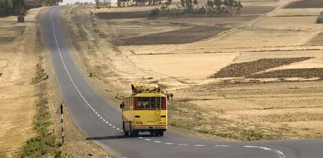 A bus travelling along a highway.