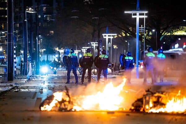 Rioters set fires on the streets of Rotterdam, the Netherlands, on Friday.