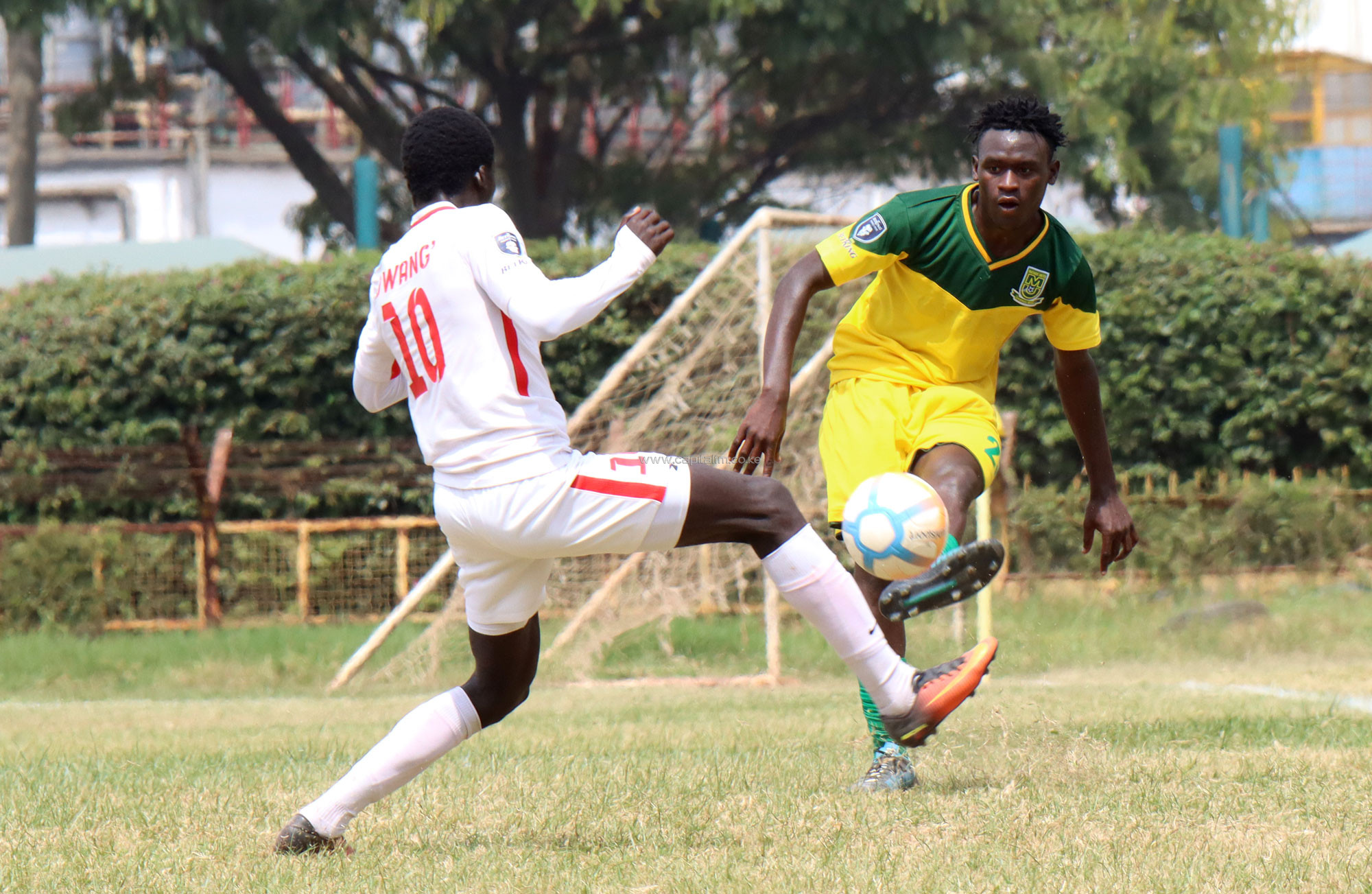 Mathare United's Norman Ogoalla attempts to make a past against Posta Rangers' Jackson Dwang during their BetKing Premier League match at the Ruaraka Complex on June 26, 2021. PHOTO/Timothy Olobulu