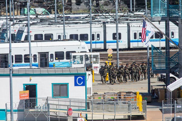 Tactical law enforcement officers moved through the light rail yard where a shooting occurred in San Jose, Calif., on Wednesday