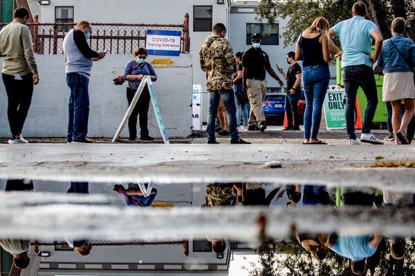 People wait in line to be tested for the coronavirus at a testing site in Miami earlier this month.