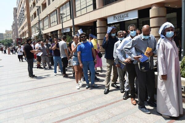 A line, mostly consisting of residents of Iran, waited to receive Covid-19 vaccines in Yerevan, Armenia, on Friday. Armenia’s offer of free vaccines to any foreign visitor has drawn many from neighboring countries.