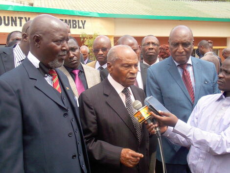 Dr. Charles Wanyoike Rubia EBS, EGH, Adressing members of the Press. He is flanked by Dr. D. Nyamu- Njoka and Hon. L. Nduati Kariuki, Speaker of the Murang'a County Assembly on June 8, 2016.