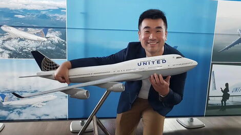File Photo of Influencer Sam Chui holding a caricature plane