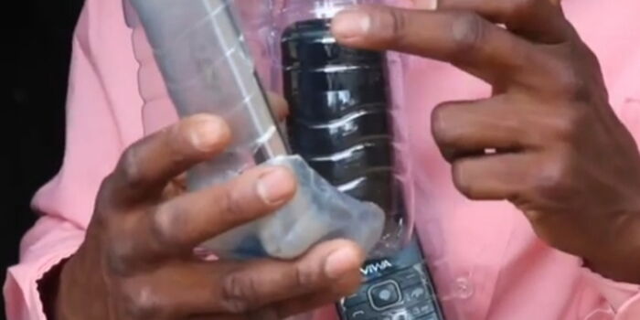 Desperate Kenyans Catching Mobile Phone Signal Using Bottles