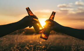 individuals enjoying bottles of beer 