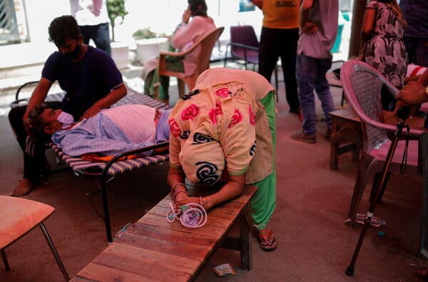 A woman pleaded for oxygen for her husband at a Sikh temple, in Ghaziabad, India, on Monday.