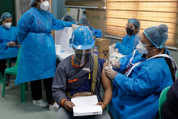 Workers at the Navotas Fish Port received the Covid vaccine in the Philippines, on Monday.