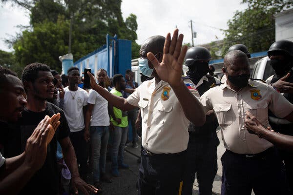 Haitians pressured the police on Thursday to hand over the bodies of two men killed in a shootout.