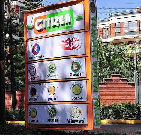 A signboard showing Royal Media Services (RMS) broadcast stations along Dennis Pritt Road.
