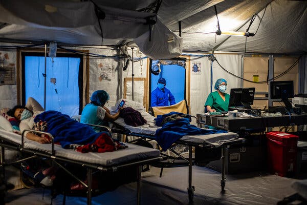 Patients in tents outside Kennedy Hospital in Bogotá, Colombia, this month. Colombia has been able to issue a first vaccine to just 6 percent of its population.