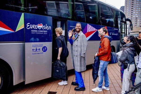 Jeangu Macrooy, center, representing the Netherlands, boarded a bus on Saturday to the Eurovision Song Contest Final in Rotterdam.