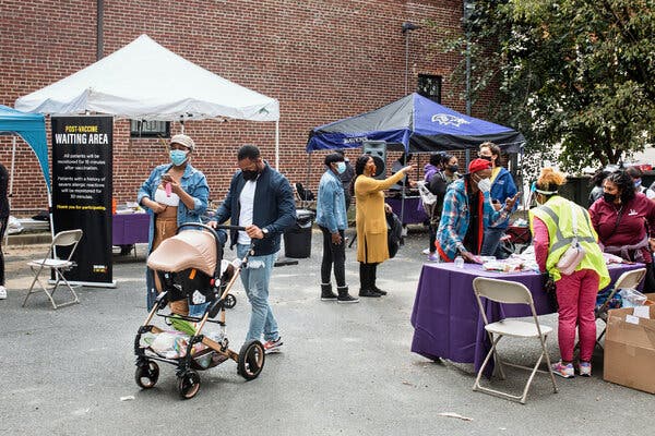 Families attending the DRU Mondawmin Healthy Families event and vaccine clinic in Baltimore last week. Community outreach will be integral to the vaccine rollout for children.