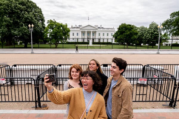 From left, Eliana Lord, Carly Mihovich, Stephanie Justice and Nick Hansen, visiting from Columbia, S.C., took a photo at Lafayette Park on Monday.
