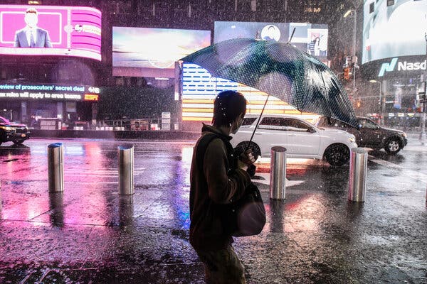 Heavy rainfall from the remnants of Hurricane Ida drenched Times Square in New York late Wednesday.
