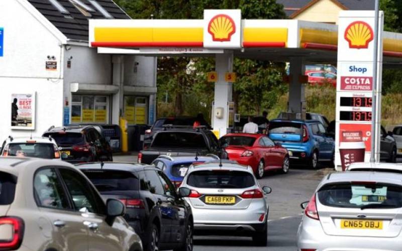Behave normally, fuel-starved Britons told